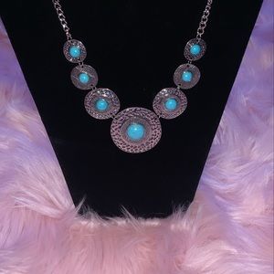 A pair of earrings and a necklace